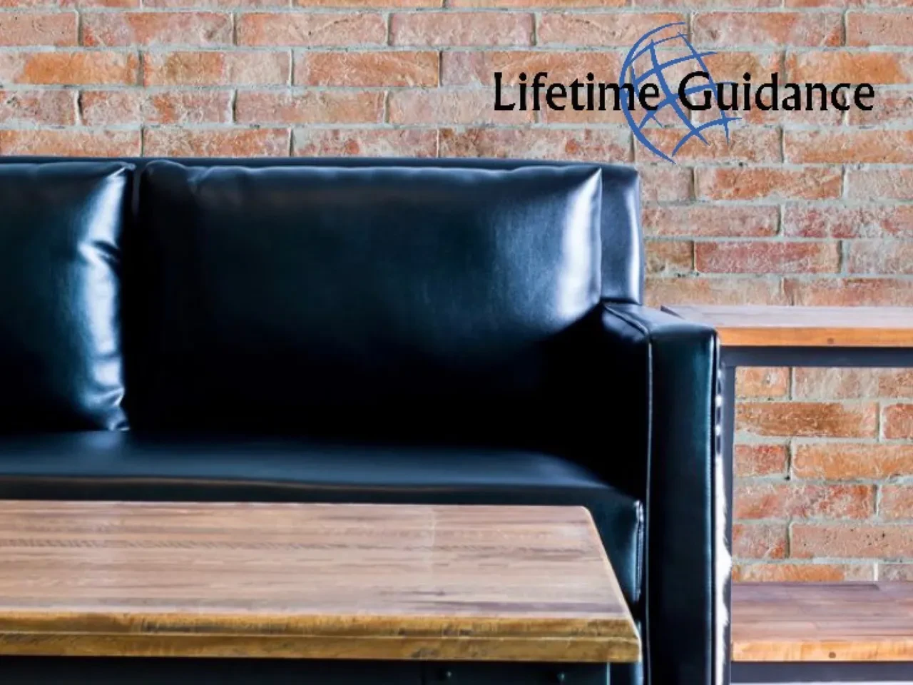 Lifetime Guidance — professional coaching office with brick wall and leather sofa